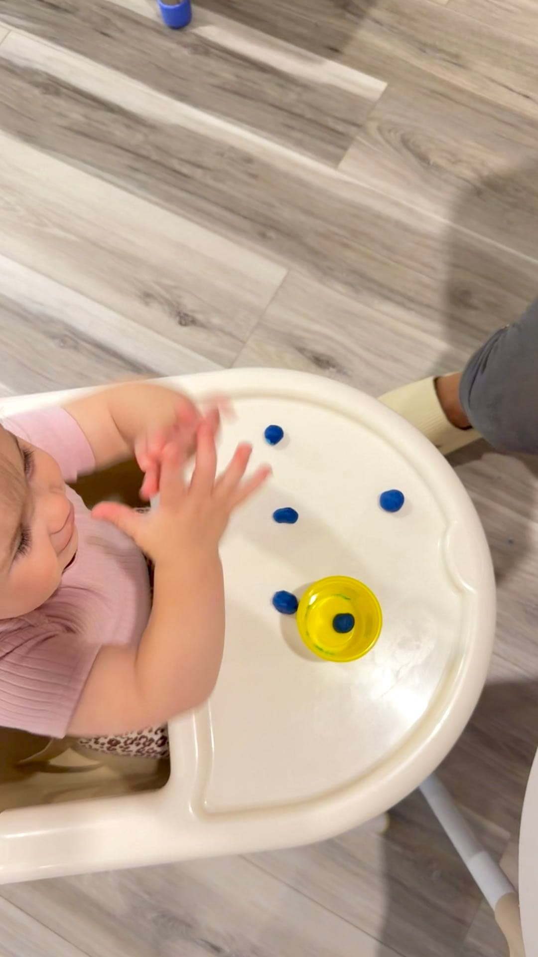 Infant reaching for a toy