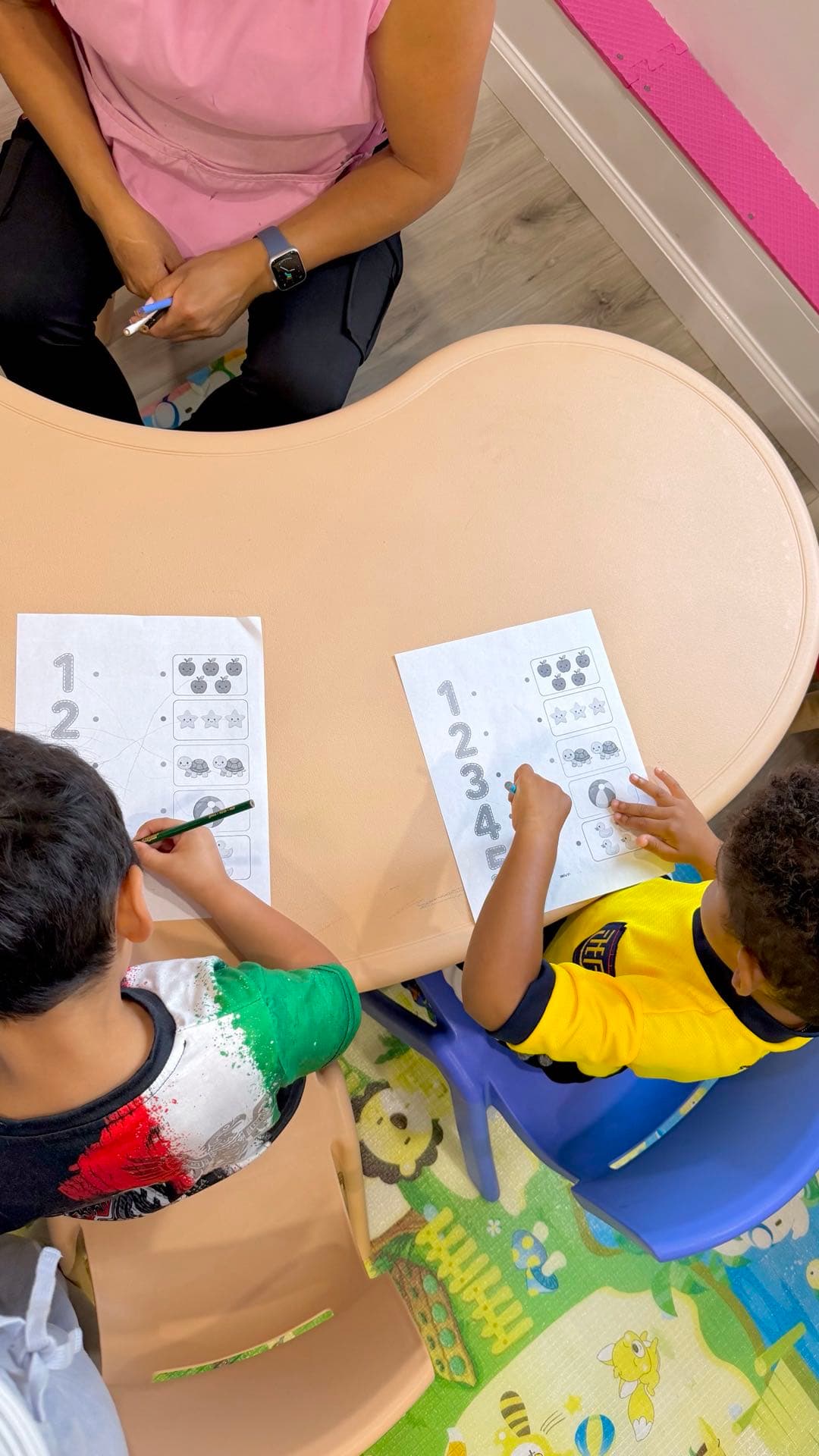 Preschoolers practicing writing